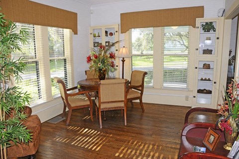 a dining room with a table and chairs