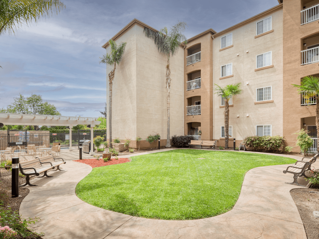Courtyard with Grassy Area at Hayward Village Senior Apartments in Hayward CA