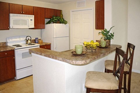 a kitchen with a counter top and a stove