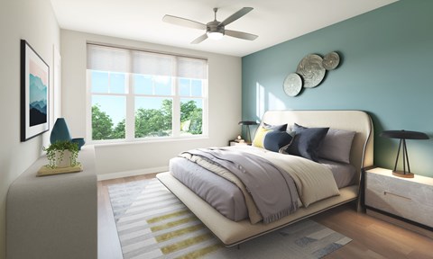 A bedroom with a large bed and a ceiling fan.