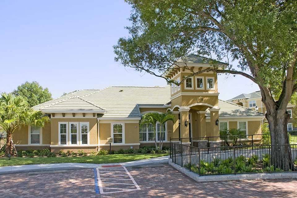 a large house with a large tree in front of it