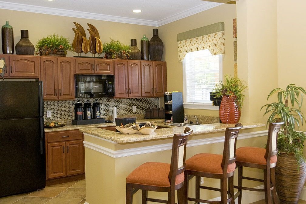 a kitchen with a counter top and a refrigerator