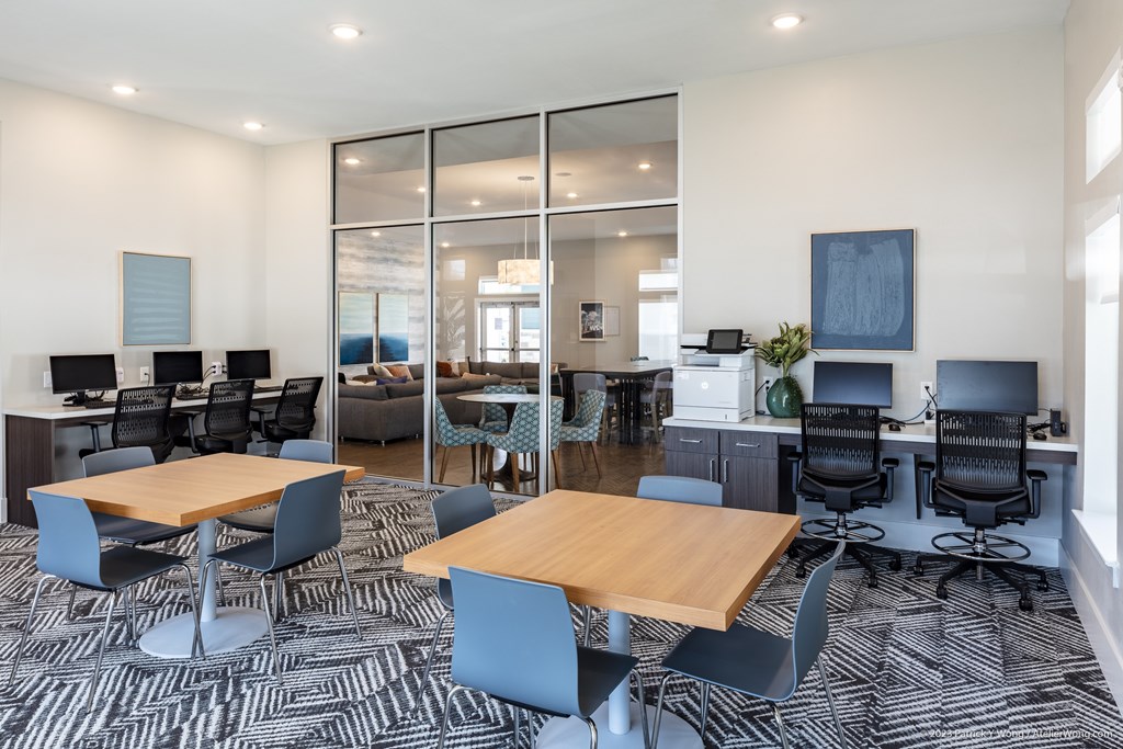 A modern office space with a combination of wood and metal chairs.