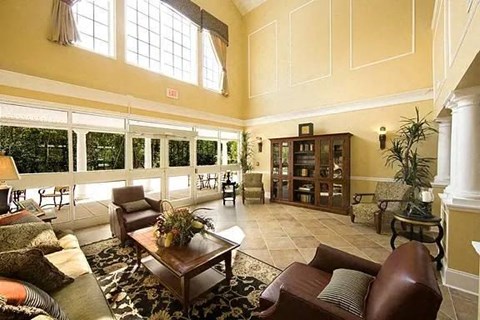 a large living room with couches and a table
