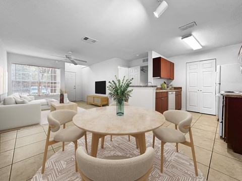A modern dining room with a round table and chairs.