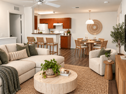 A living room with a couch, chairs, and a coffee table.