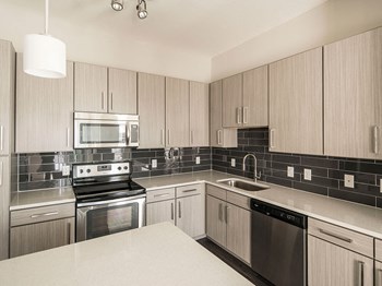 Chef-Style Kitchen at Parc at White Rock Luxury Apartments in Dallas TX - Photo Gallery 10