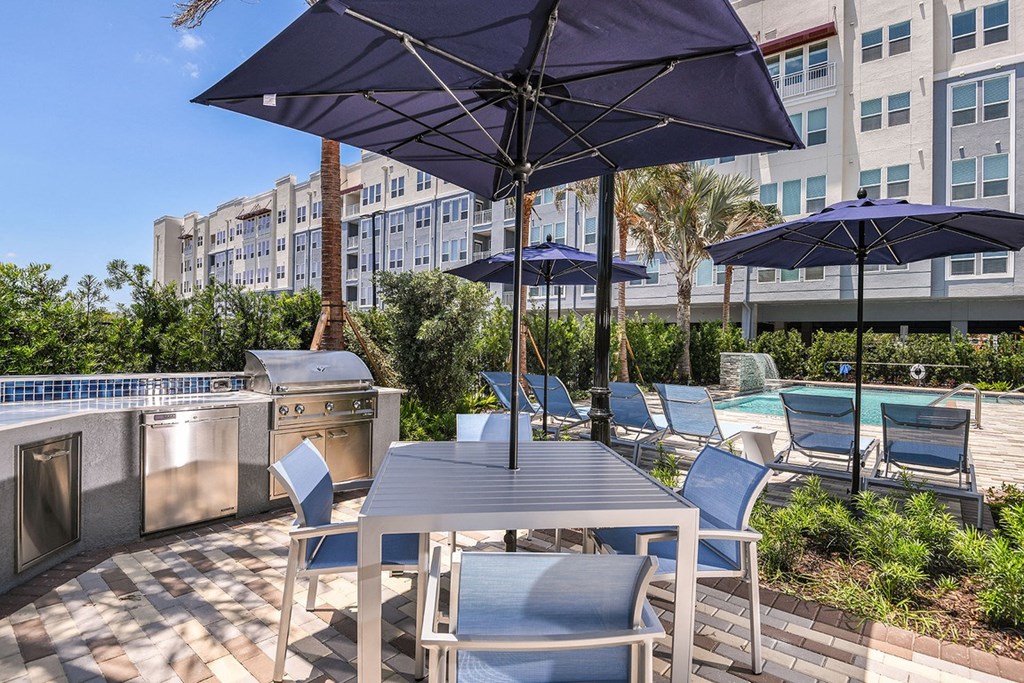 Outdoor kitchen grilling area at The Exchange Luxury Apartments in St. Petersburg, FL