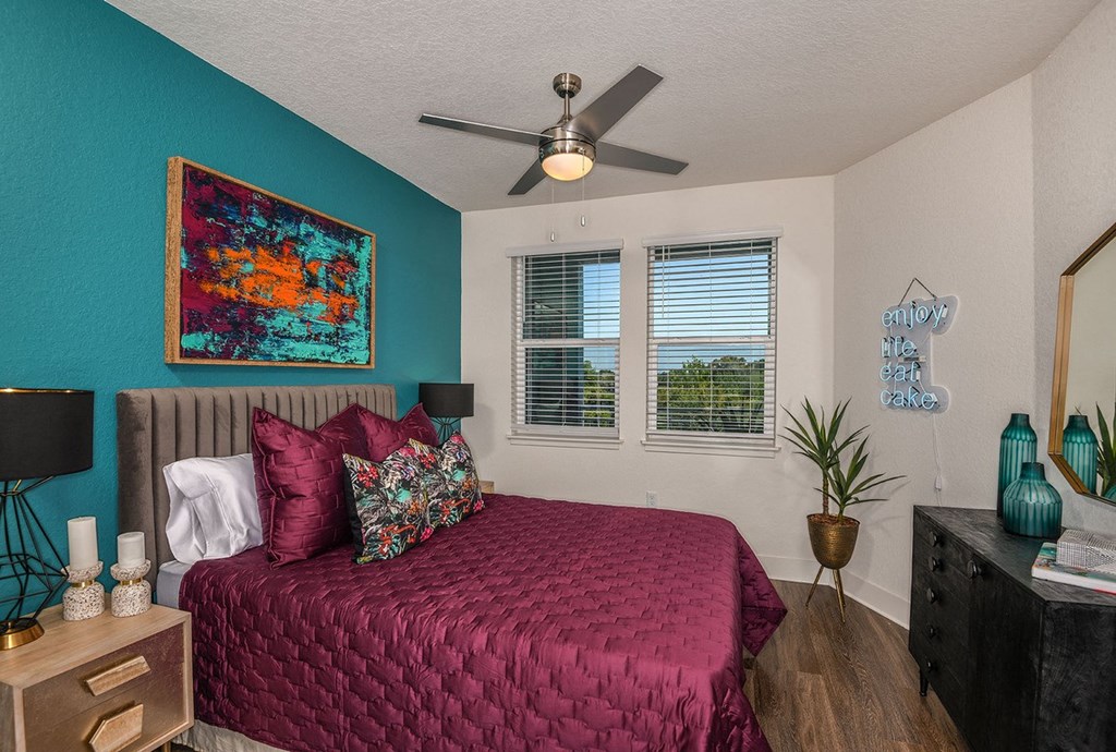 Designer bedroom with city views at The Exchange Luxury Apartments in St. Petersburg, FL