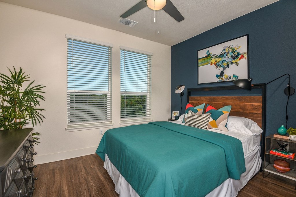 Bedroom with wood floooring at The Exchange Luxury Apartments in St. Petersburg, FL