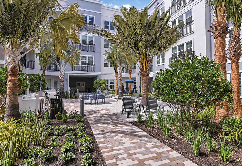 Outdoor garden courtyard at The Foundry Luxury Apartments in Tampa FL
