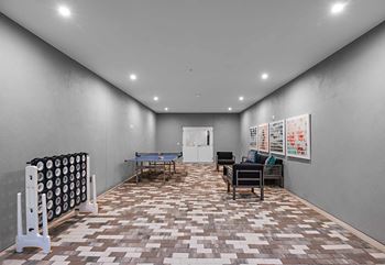 Enclosed Outdoor Entertainment Areas with Lounge Areas & Outdoor Games at The Foundry at NoHo, Tampa, FL, 33606