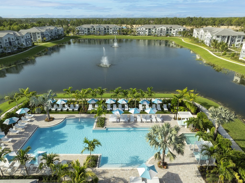 Resort-Style Pool Overlooking Pond at Everly Apartments in Naples, FL Resort-Style Pool Overlooking Pond at Everly Apartments in Naples, FL
