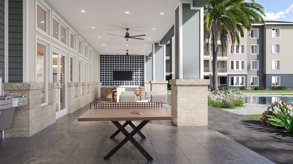 Outdoor Lounge with Yard Games at Cedar Heights Luxury Apartments in Austin, TX