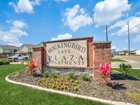 Entrance sign at Mockingbird Lane Plaza Affordable Apartments in Victoria TX