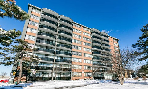 full view of an apartment building in the snow