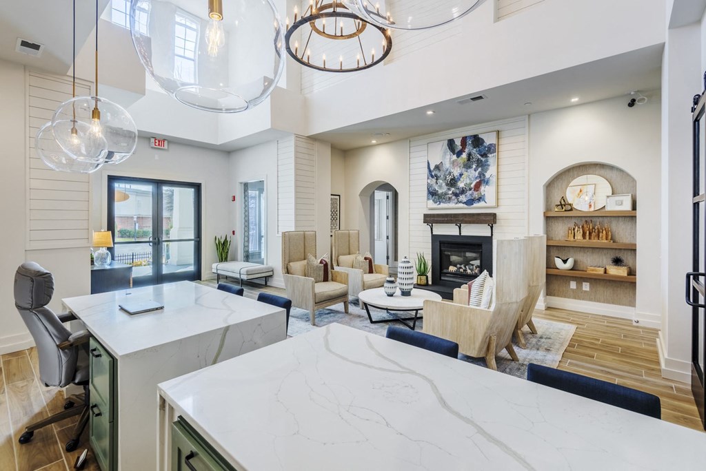 a living room with a kitchen and a fireplace