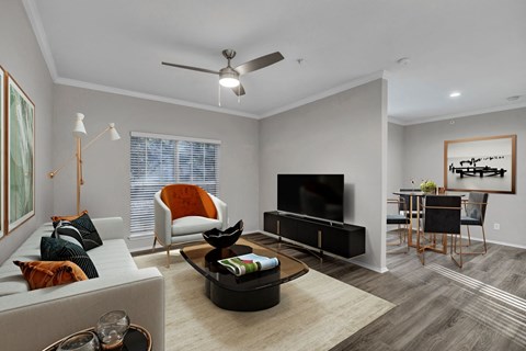 a living room with grey walls and a white couch