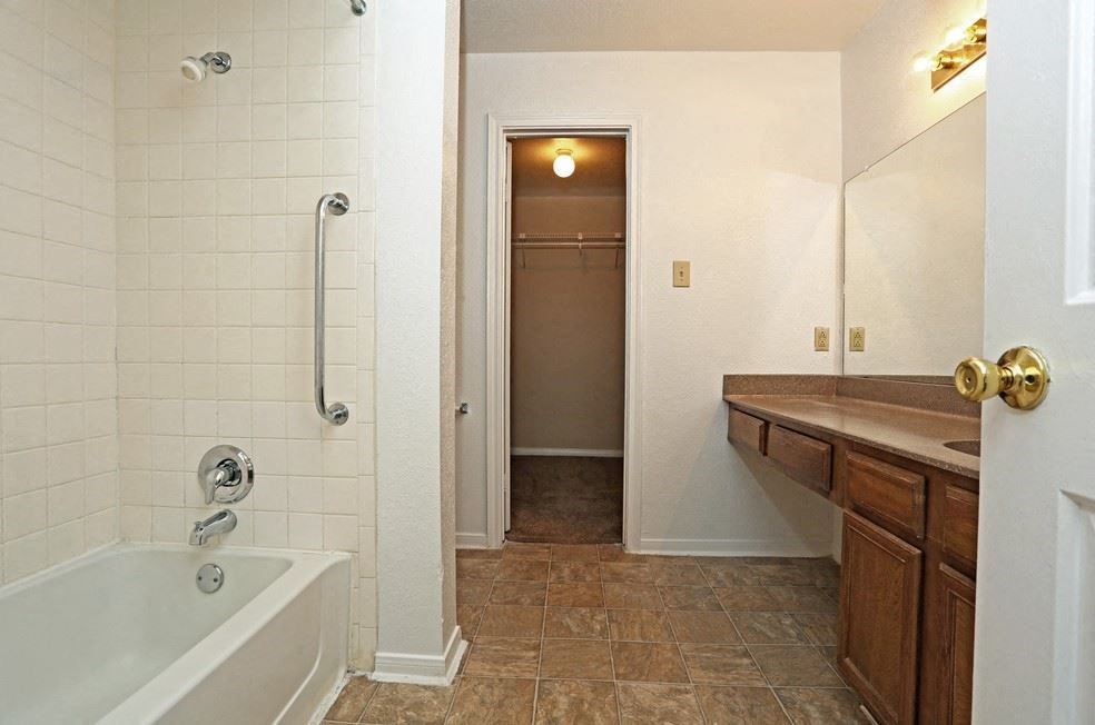 Bathroom with bath tub at Village Oaks Apartments, Austin