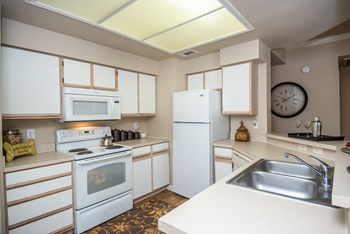 Kitchen with white appliance package | Sedona Springs - Photo Gallery 17