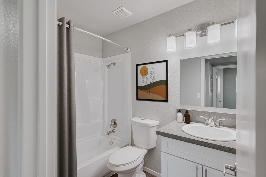 a bathroom with a shower toilet and sink at 2300 West Apartments, Reno, NV, 89502