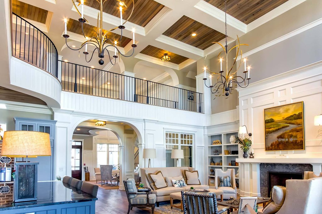 A large, well-furnished living room with a balcony at Wharf 7 Apartments, South Carolina 29492