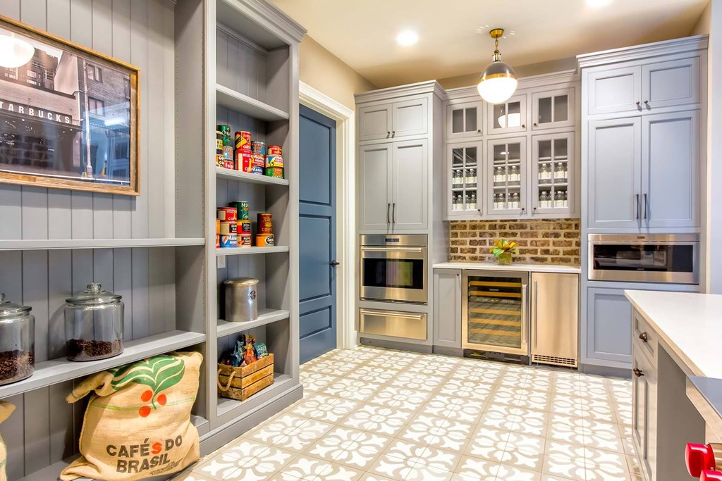 A kitchen with a bag of Caffe'o Brazil coffee beans on the floor at Wharf 7 Apartments, Charleston, South Carolina