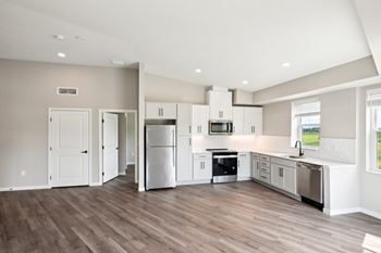 kitchen with stainless steel appliances and a window above the sink