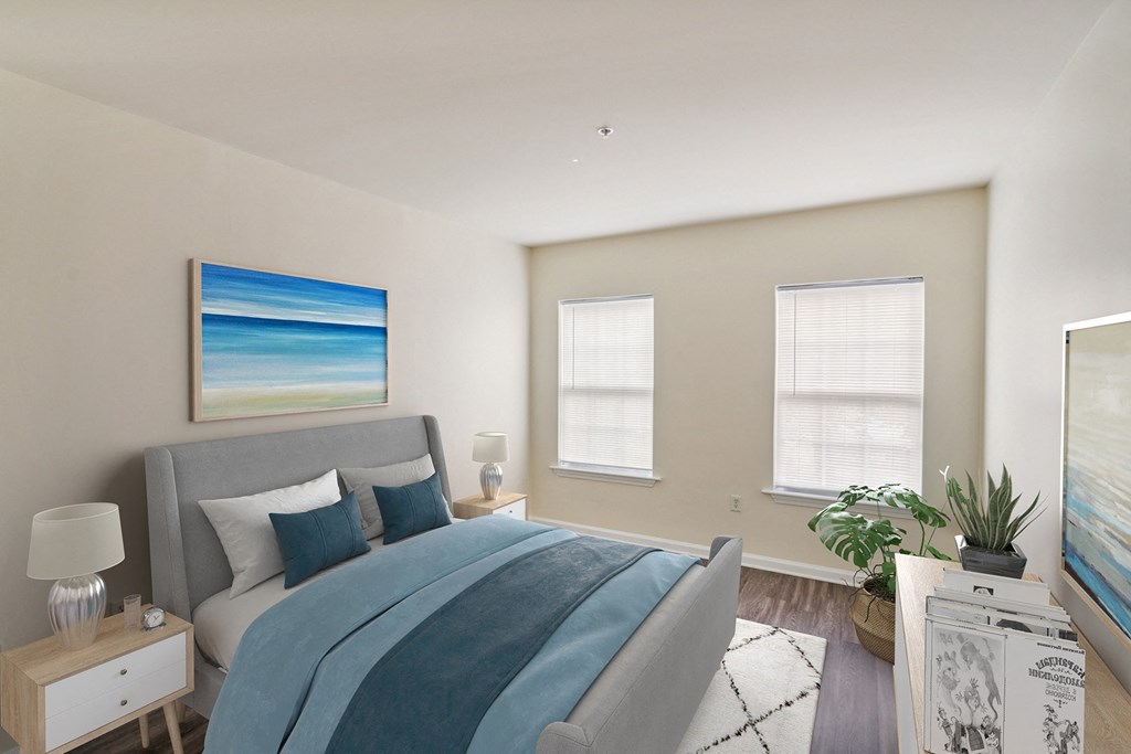 a bedroom with a bed and two windows at Highlands at Faxon Woods, Quincy, Massachusetts