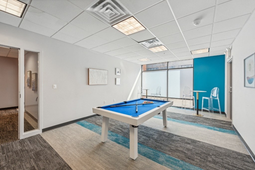 a game room with a pool table at Residences at Manchester Place in Manchester, New Hampshire