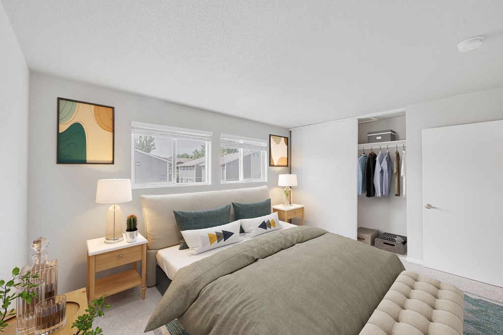 a bedroom with a large bed and a walk in closet a bedroom with a large bed and a walk in closet at 2300 West Apartments, Reno, Nevada