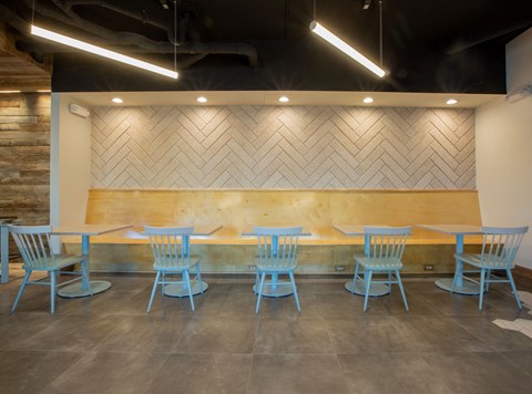 a table and chairs in front of a wood wall at 511 Meeting, South Carolina, 29403