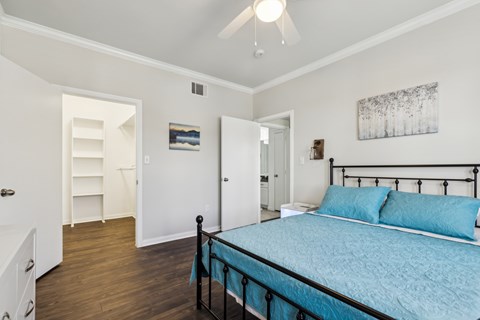 A Bedroom with a Dresser at Flats on Chapel Apartments, Waco, TX
