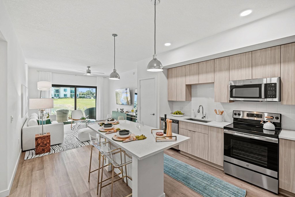 A modern kitchen with a dining table and chairs.