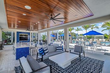 Poolside outdoor pavilion with lounge chairs