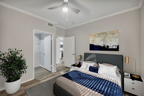 a bedroom with a large bed and a ceiling fan at River Stone Ranch, Texas