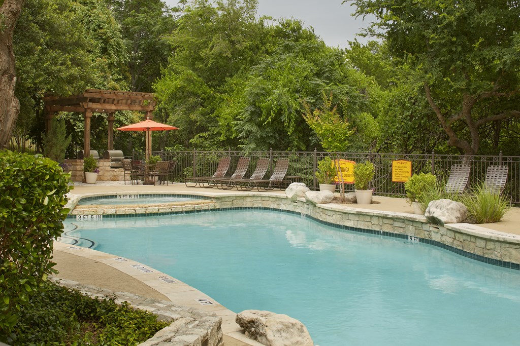 Community pool with lounge chairs at Museo, Austin, 78759