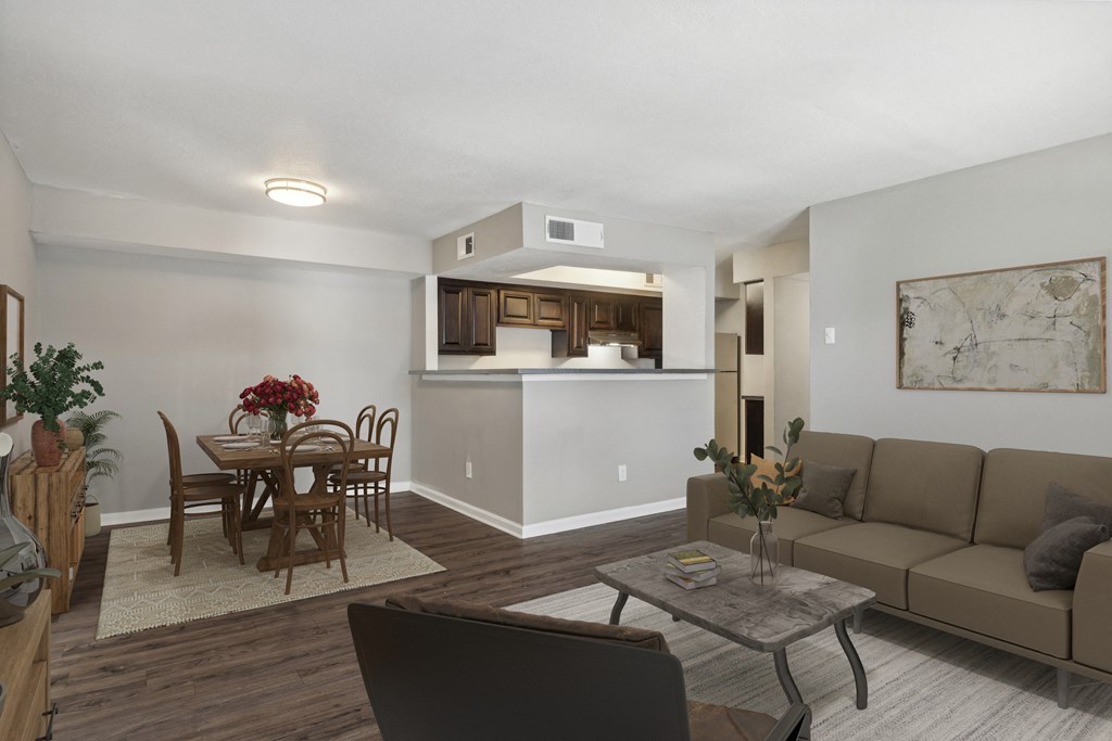 A living room with a dining table and chairs.