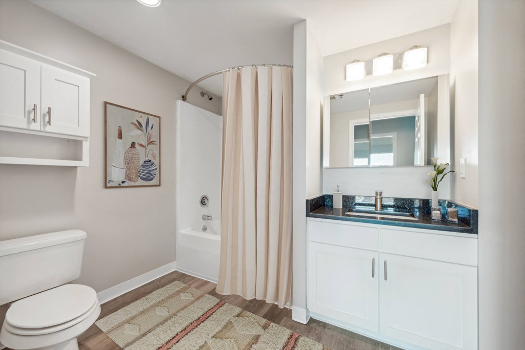a bathroom with a shower and a sink at the Residences at Manchester Place in Manchester, New Hampshire