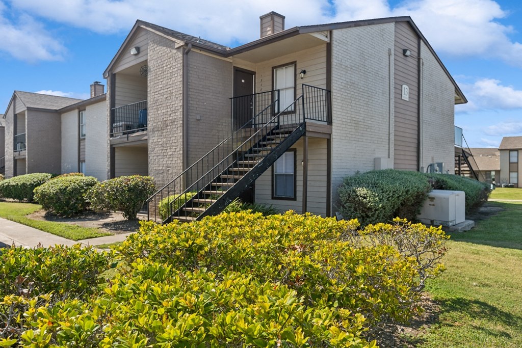 A house with a staircase leading to the second floor.