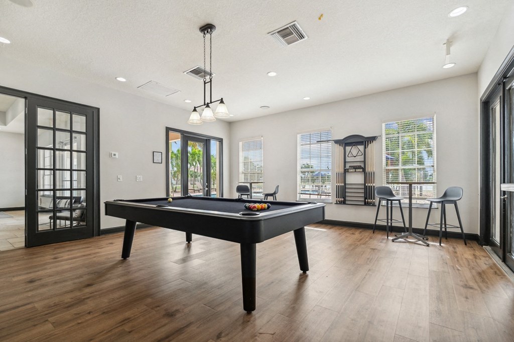 spacious game room with pool table at Bay Breeze Villas, Fort Myers, FL, 33908