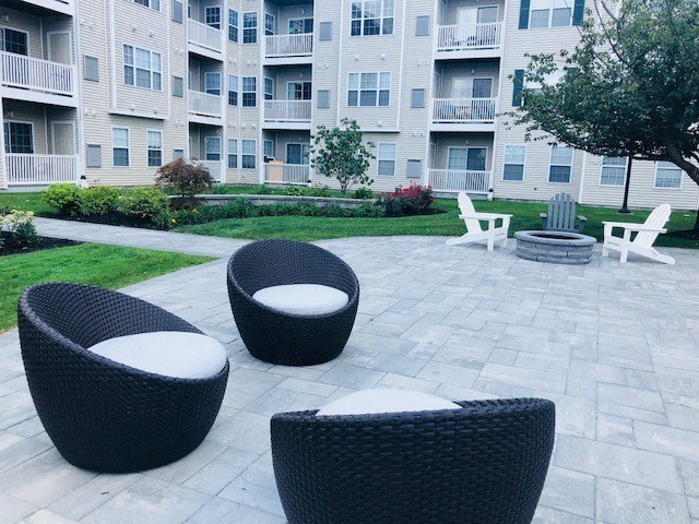 Community patio and lounge area at Highlands at Faxon Woods, Quincy