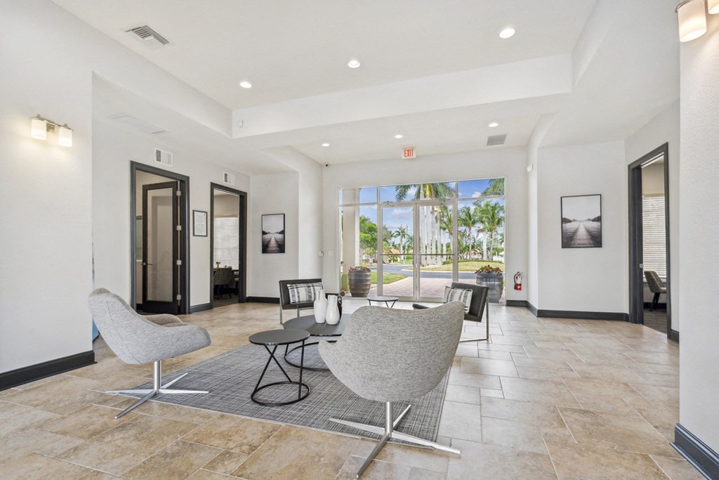 community lobby with chairs and tables at Bay Breeze Villas, Fort Myers, Florida