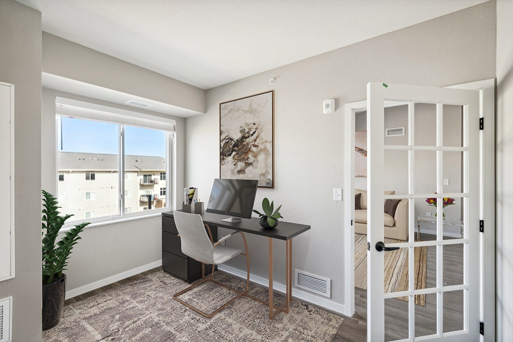 an office with a window and a desk with a computerat SoRoc On Maine, Rochester, MN 55904