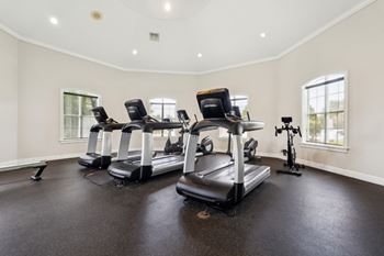 a gym with treadmills and exercise bikes  at Ballantrae Apartments, Sanford, FL