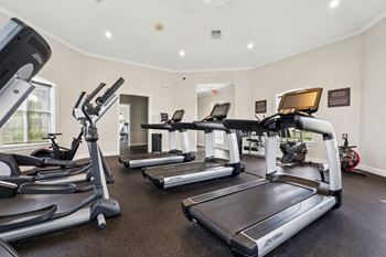 a gym with treadmills and exercise bikes  at Ballantrae Apartments, Sanford, FL