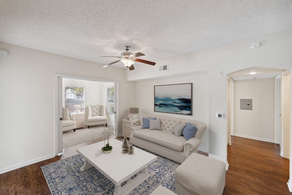 Living room with a couch and a coffee table and a ceiling fan at Via Lugano, Boynton Beach, Florida