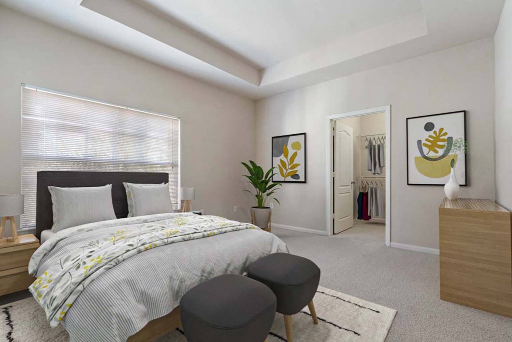 a bedroom with a bed and a closet a bedroom with a bed and a closet at Grandeville on Saxon, Orange City, Florida