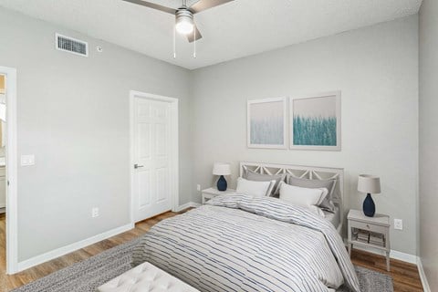 a bedroom with a bed and two night stands  at Ashlar, Fort Myers, Florida