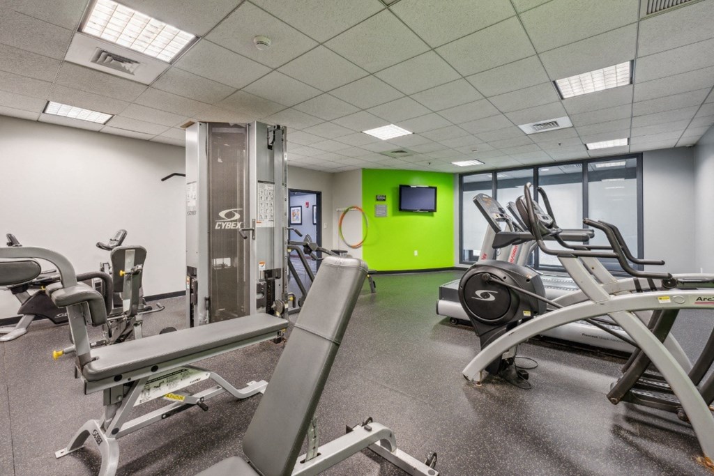 a gym with exercise equipment at Residences at Manchester Place in Manchester, New Hampshire